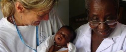 An intern from Projects Abroad holding a new born baby during her midwifery internship in Ghana. An intern from Projects Abroad is pictured holding a new born baby during her midwifery internship in Ghana.
